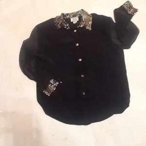 Lady's black and gold dressy top.